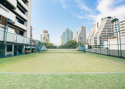 Tennis court within a residential building complex