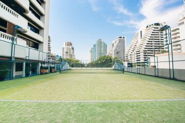Tennis court within a residential building complex