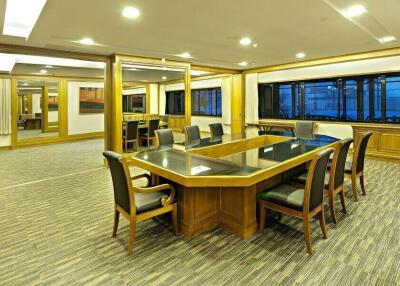 Spacious conference room with large table and seating