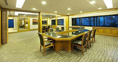 Spacious conference room with large table and seating