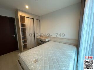 Modern bedroom with large bed and built-in wardrobe