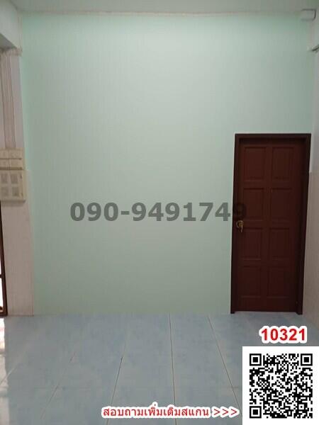 Empty room with light blue walls and tiled floor
