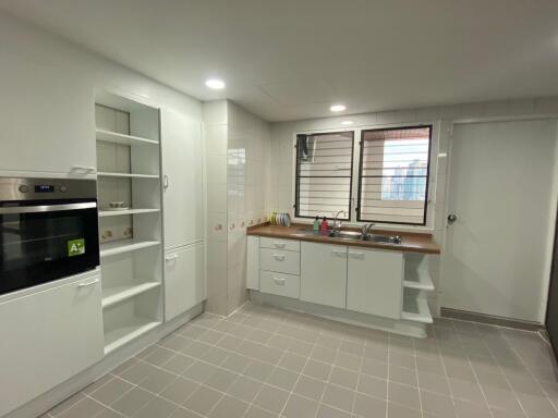 Modern kitchen with built-in appliances and ample cabinet space