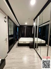 Modern bedroom with mirrored wardrobe and en suite bathroom