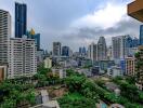 Panoramic cityscape view from a high-rise apartment balcony