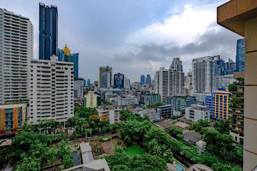 Panoramic cityscape view from a high-rise apartment balcony