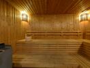 Spacious wooden sauna with tiered bench seating