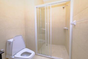 Modern bathroom with shower enclosure and toilet