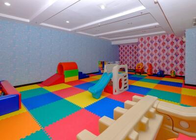 Colorful indoor playroom with toys and play structures