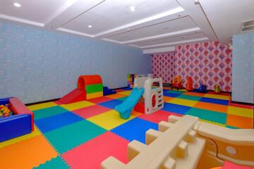 Colorful indoor playroom with toys and play structures