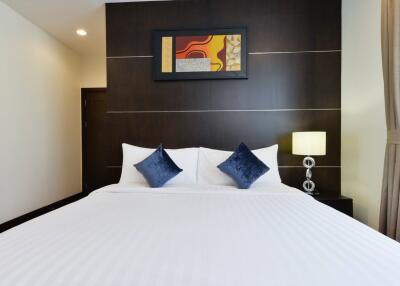 Elegant bedroom with modern design and artwork