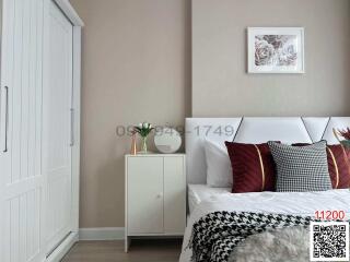 Elegantly decorated modern bedroom with neutral tones and comfortable bedding