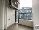 Spacious balcony with outdoor air-conditioning unit and view of exterior buildings