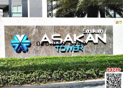 Exterior view of Asakan Tower with signage