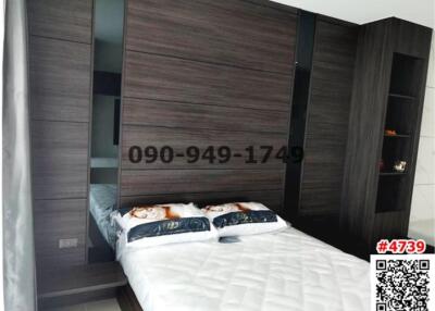 Modern bedroom with large wardrobe and queen-sized bed
