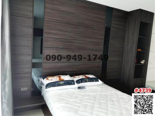Modern bedroom with large wardrobe and queen-sized bed