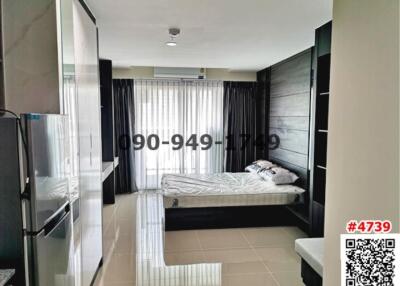 Modern bedroom with integrated appliances and ample natural light
