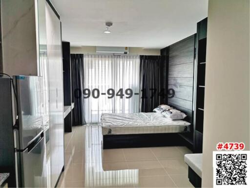 Modern bedroom with integrated appliances and ample natural light