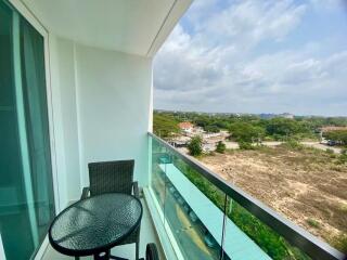 Spacious balcony with outdoor seating and scenic view