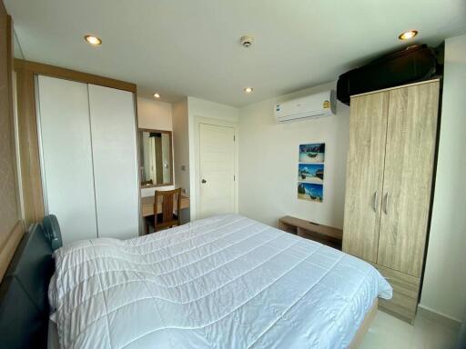 Well-lit Bedroom with Double Bed and Modern Amenities