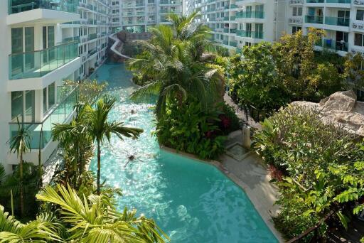 Luxurious residential complex with tropical garden and winding pool