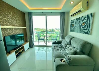 Modern living room with balcony access and natural lighting