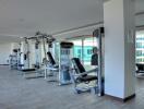 Modern gym with various exercise machines in a residential building