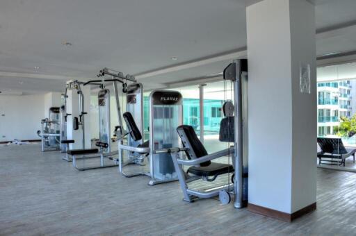 Modern gym with various exercise machines in a residential building