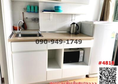 Compact modern kitchenette with appliances and shelving