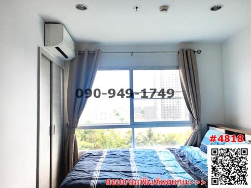 Cozy bedroom with a view and modern air conditioning unit