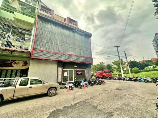 Exterior view of a commercial building with parking space