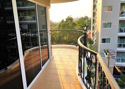 Spacious balcony with decorative railing providing a scenic view and ample sunlight