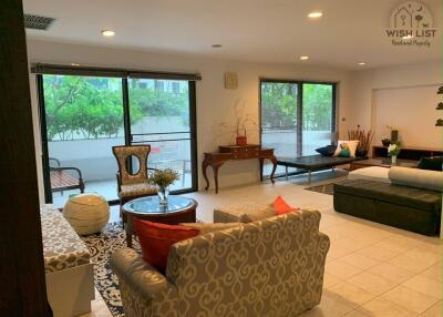 Spacious living room with natural light and modern decor