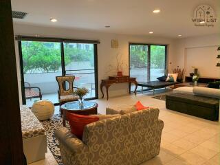 Spacious living room with natural light and modern decor