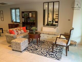 Elegant living room with modern furnishings and decorative rug