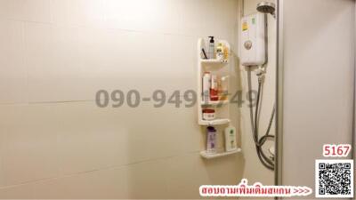 Compact bathroom with wall-mounted water heater and shower