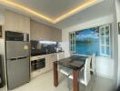 Modern kitchen with high-end appliances and a scenic view
