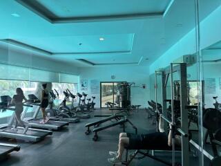 Well-equipped indoor gym with treadmills and weight stations