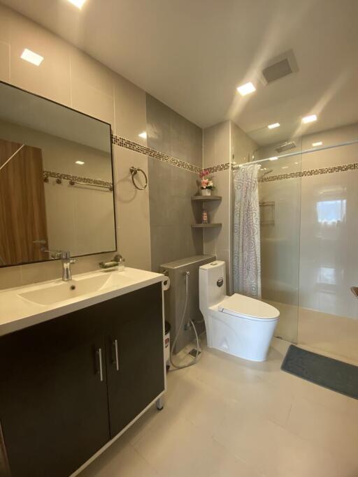 Modern bathroom interior with glass shower and vanity