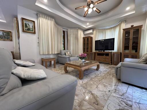 Spacious living room with elegant decor and modern amenities