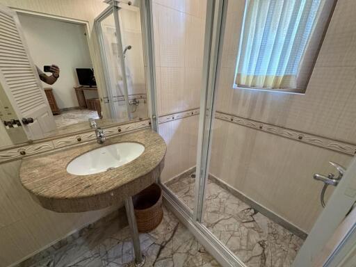 Spacious bathroom with modern shower and vanity