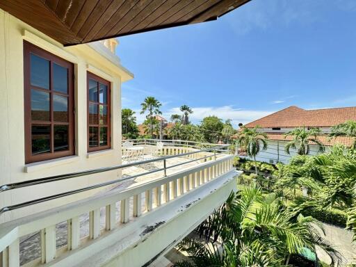 Spacious balcony with tropical views and glass railing