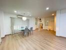 Spacious and well-lit living room with dining area