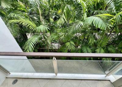 View from a balcony overlooking lush greenery