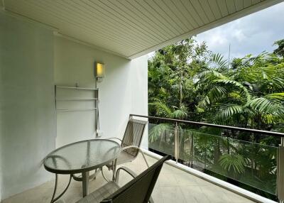 Spacious balcony with a view of lush greenery