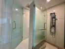Modern bathroom with glass shower enclosure and sleek fixtures