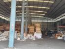 Industrial warehouse interior with storage pallets and materials