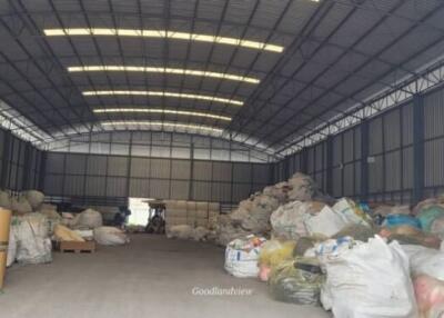 Spacious industrial warehouse interior with storage goods