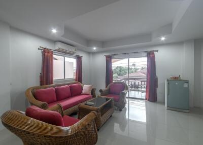 Spacious and Bright Living Room with Modern Furniture and Balcony Access