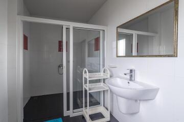Modern bathroom with shower cabin and basin